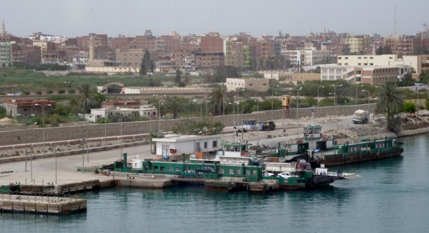 view from the canal--small city and ferry port