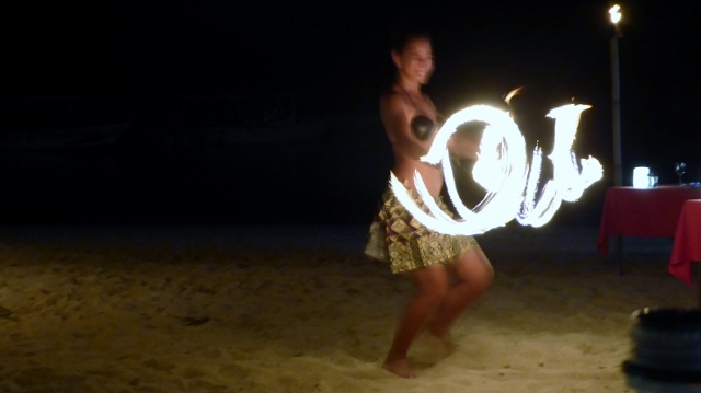 The lovely young ladies are much more graceful--even while playing with fire!!