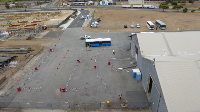 Shuttle buses are waiting to whisk us into town.