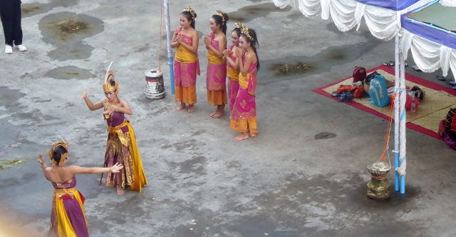 The ship was greeted by musicians and dancers on the dock.