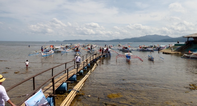 Walking out to board the outrigger.