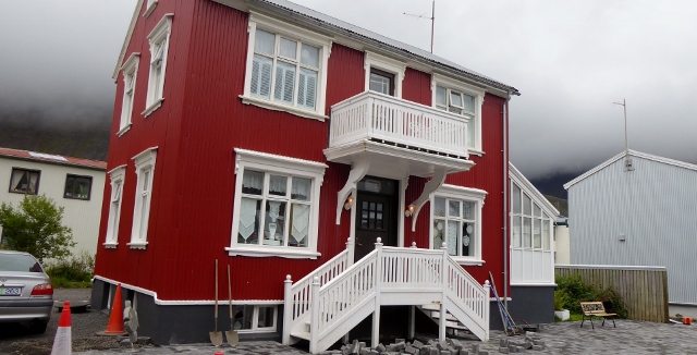 These certainly are nice looking buildings.  They all seem to be metal.