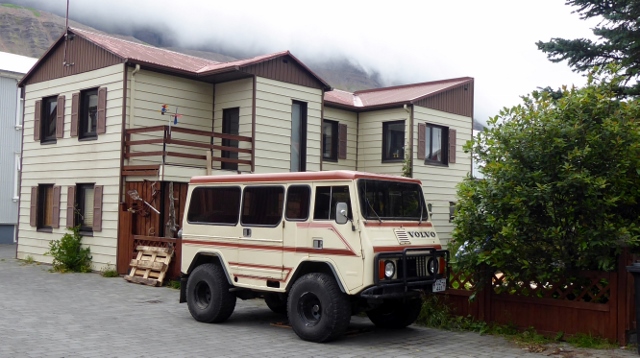 Like the vehicle!  What is it?  A Volvo van?  It matches the house!!!!!