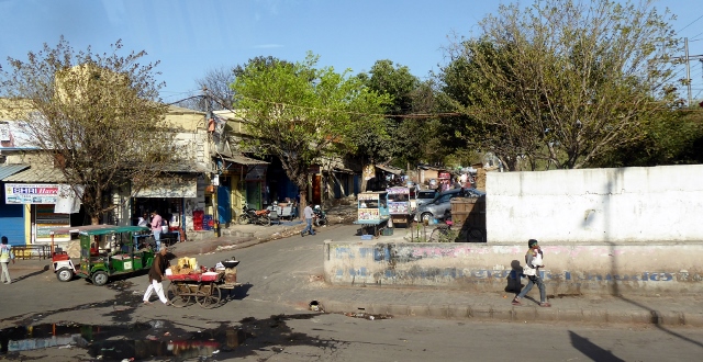 Driving through a poor part of town.