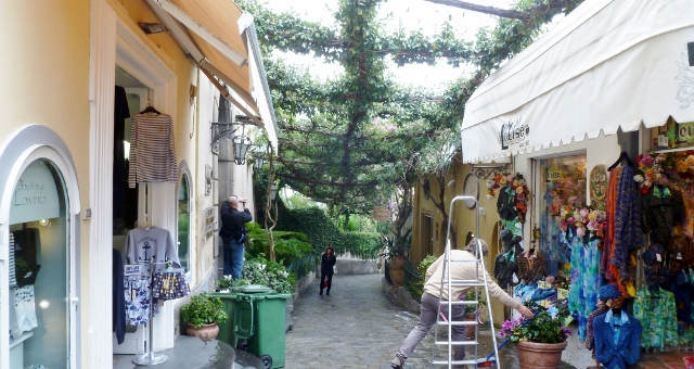 Positano merchants with their inviting shoppes beckon along the way.